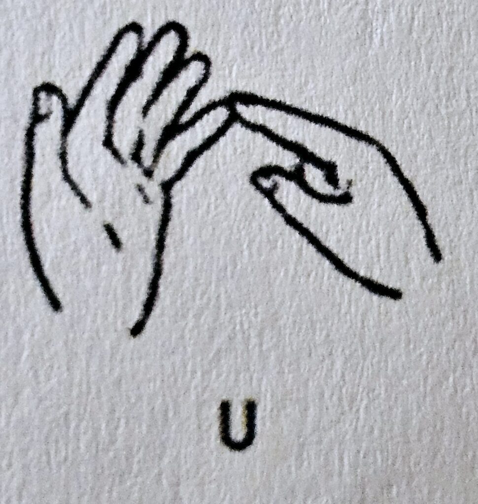The letter U in Makaton