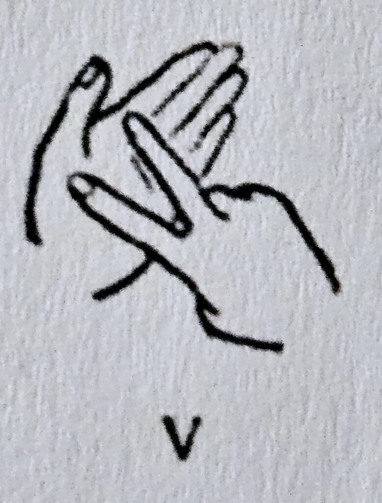 The letter V in Makaton
