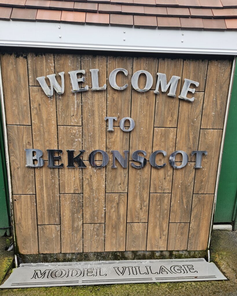 The entrance sign for Bekonscot Model Village and Railway